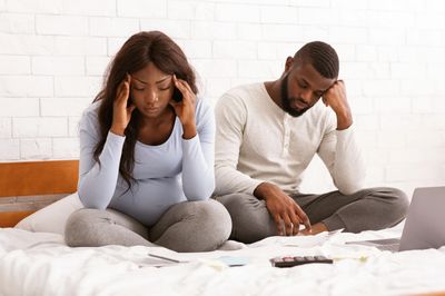 Couple dealing with the headache of debt