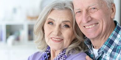 Smiling elderly couple