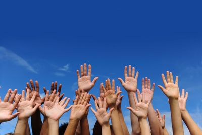 Hands reaching for the sky